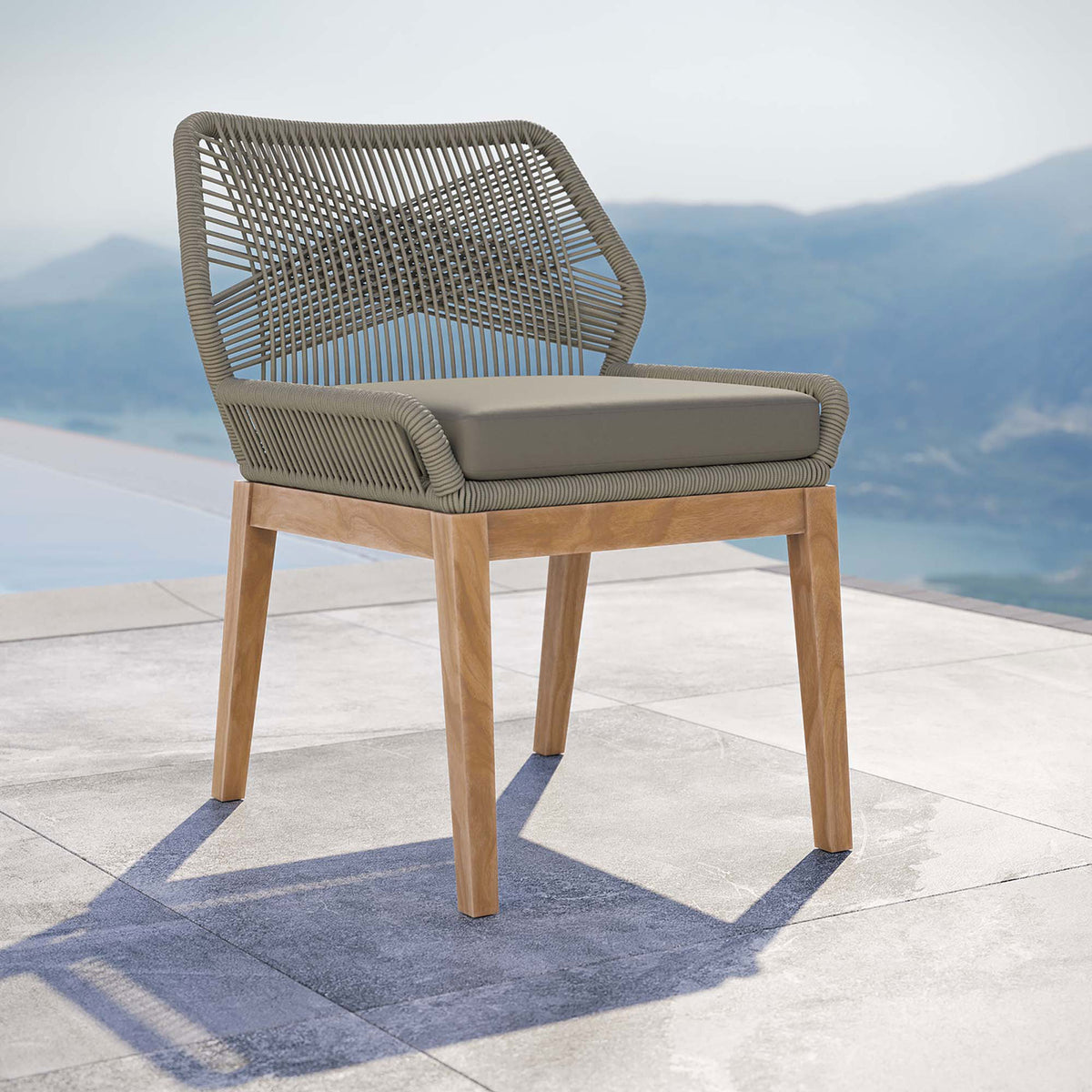 Light gray greige rope dining chair with cushion styled beside a pool for relaxed modern outdoor dining || EEI-5747-LGR-GRG || front_angle_room