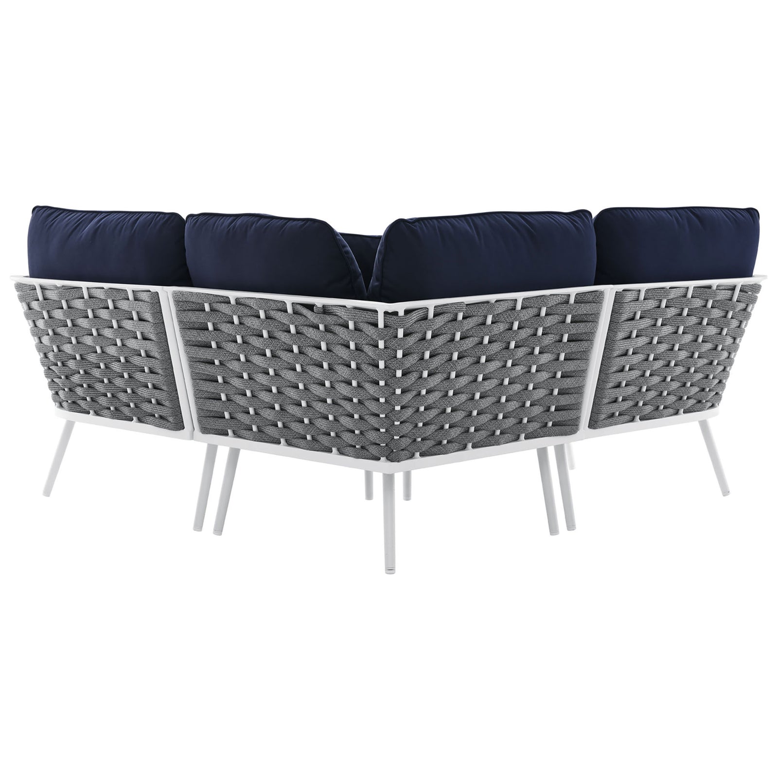 Sectional sofa shows off the sculpted gray rope lattice and navy cushions over slim white aluminum legs || EEI-5752-WHI-NAV || back_angle_studio