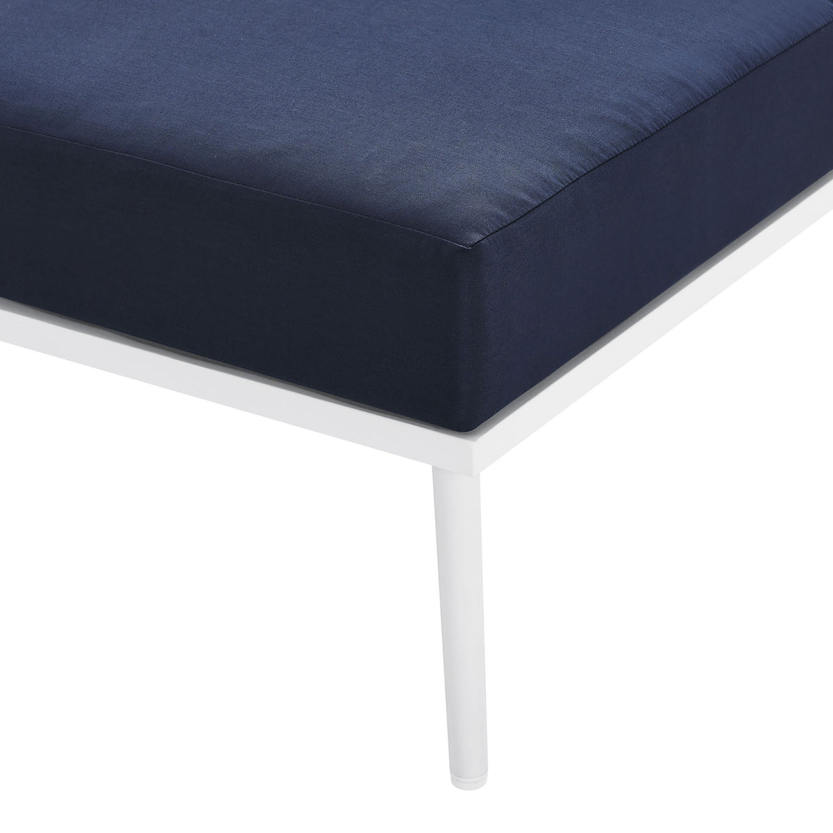 Slender white leg and smooth navy cushion underscore the sectional's polished, modern feel. || EEI-5753-WHI-NAV || leg_studio