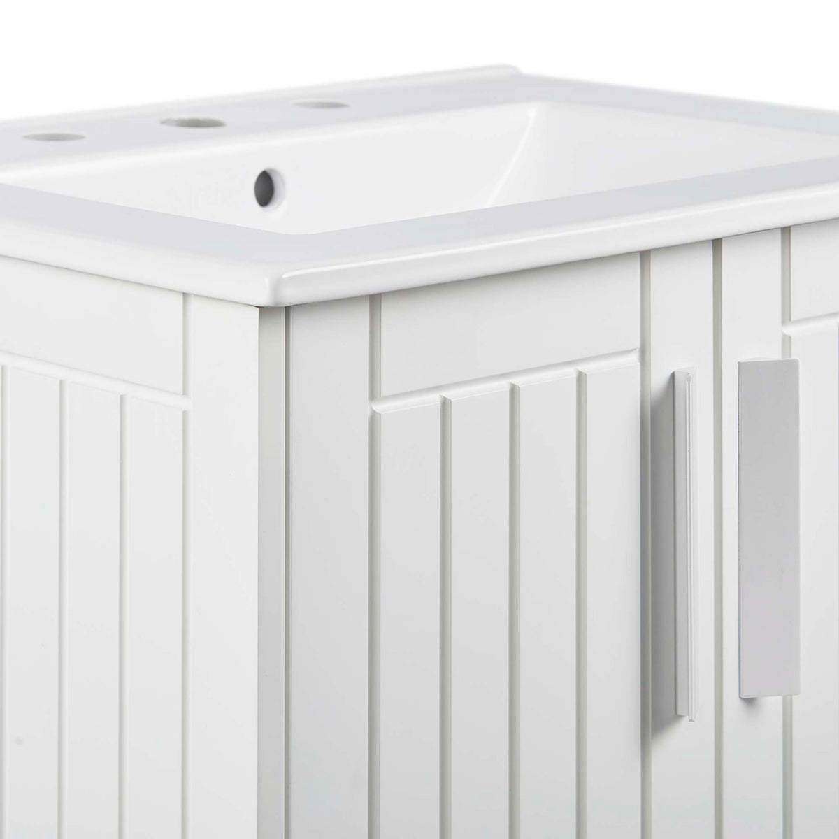 Textured paneling and streamlined rectangular door handle on the white vanity || EEI-5800-WHI-WHI || detail_studio