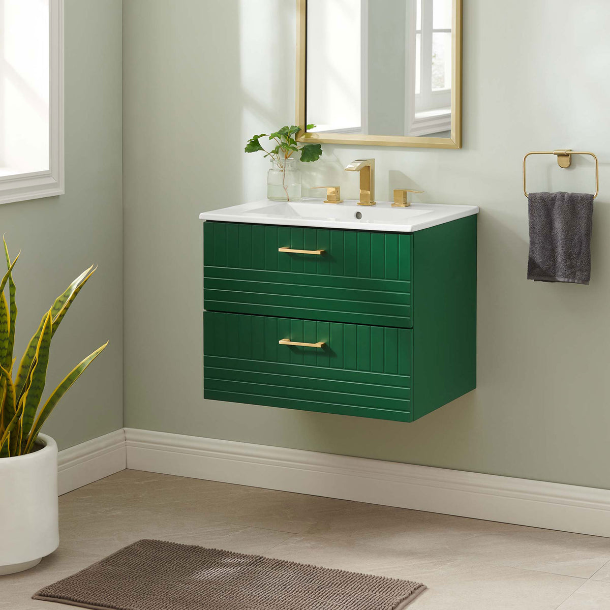 Sleek wall-mounted vanity brings crisp contrast to a modern bath, styled with gold accents. || EEI-5818-GRN-WHI || front_angle_room