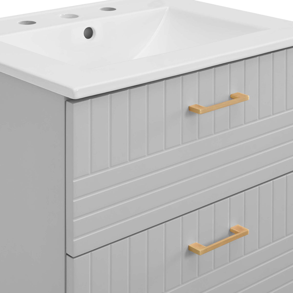 Brushed gold hardware and vertical paneling bring modern texture to the matte cabinet || EEI-5818-LGR-WHI || detail_studio
