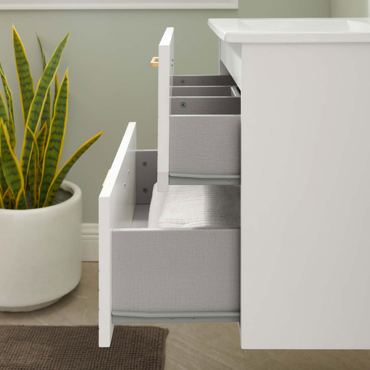 Drawers glide smoothly to keep toiletries organized in a modern vanity built for everyday use || EEI-5818-WHI-WHI || storage_open_room