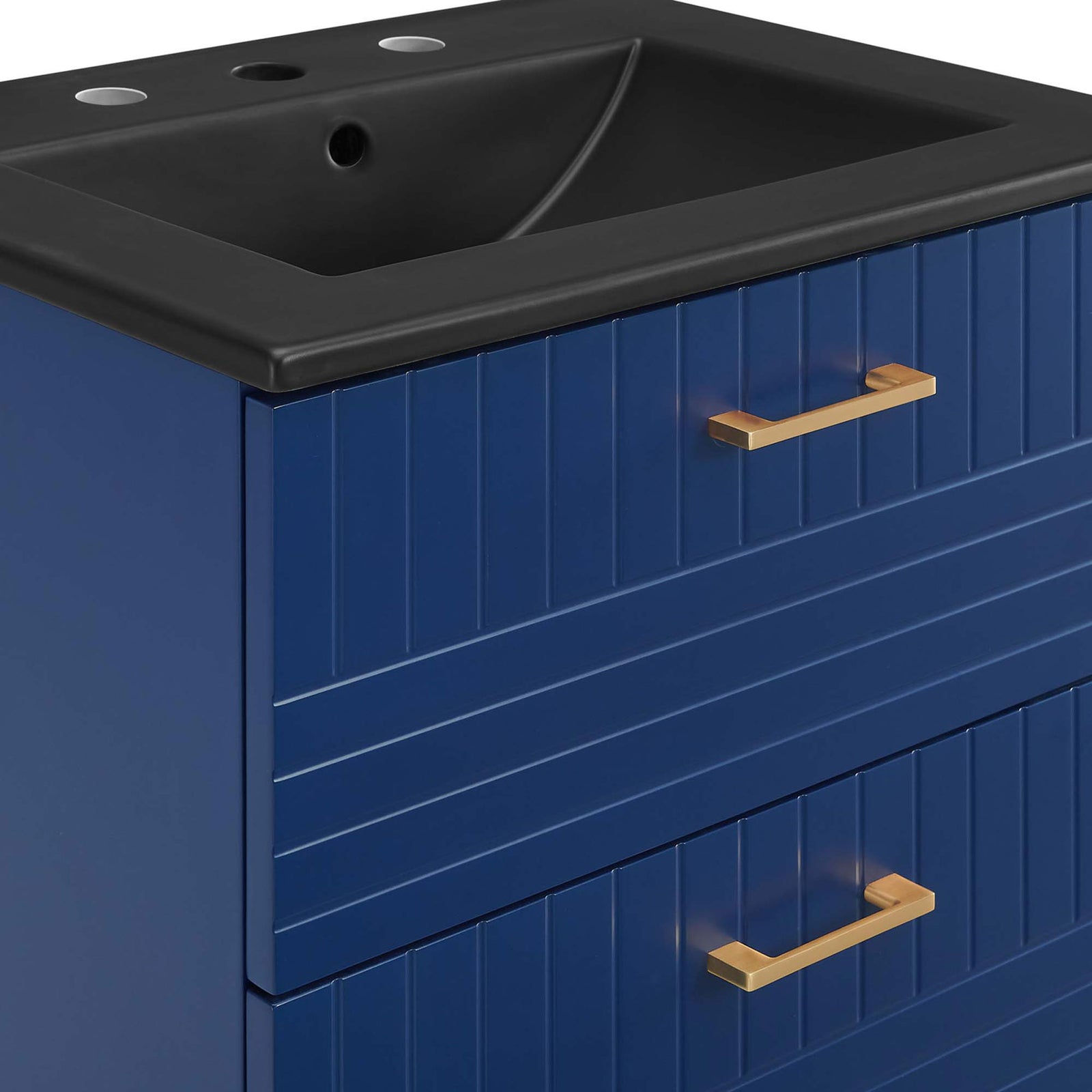 Brushed gold bar pulls add a warm accent against the ribbed blue drawer fronts. || EEI-5820-BLU-BLK || handle_studio