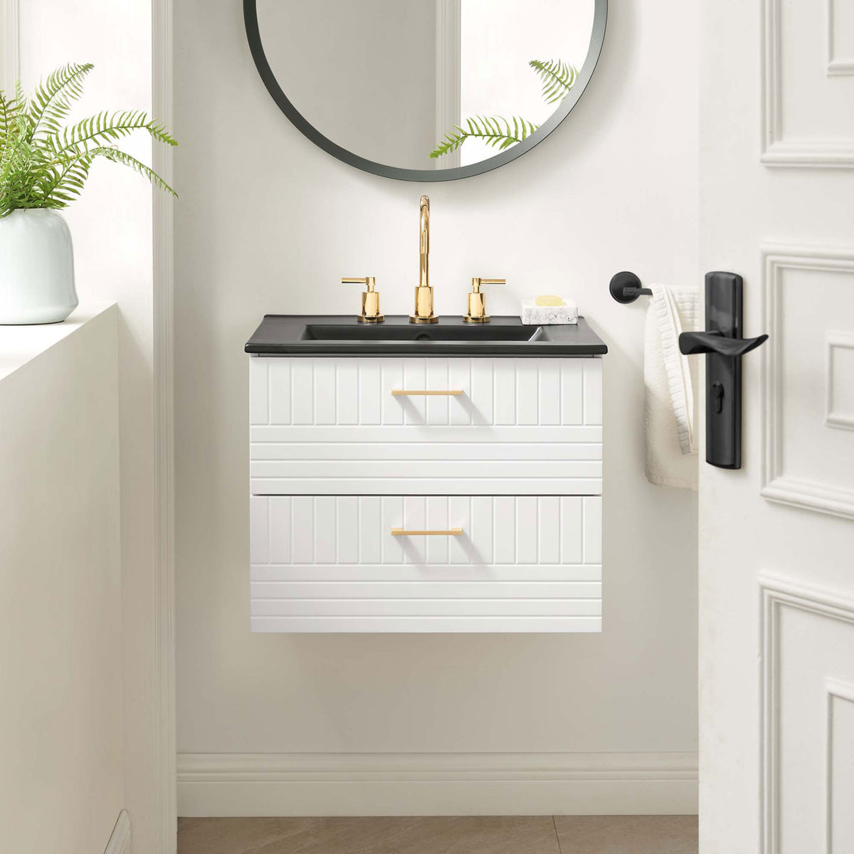 Wall-mounted vanity saves floor space and elevates the bath with a black basin and gold accents || EEI-5820-WHI-BLK || front_angle_room