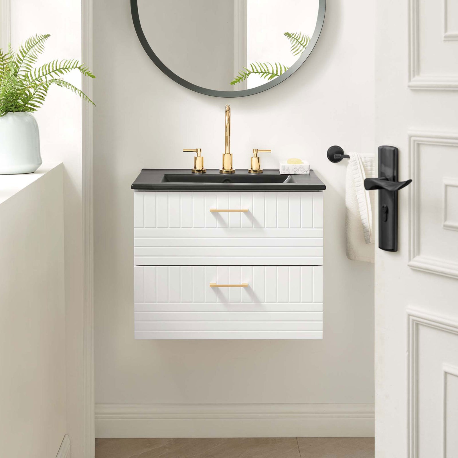 Wall-mounted vanity saves floor space and elevates the bath with a black basin and gold accents || EEI-5820-WHI-BLK || front_angle_room