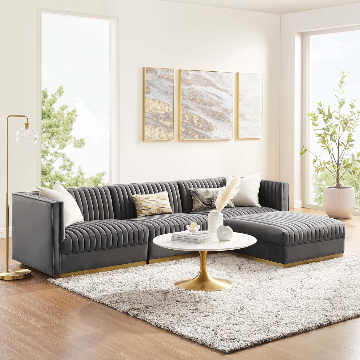 Gray velvet modular sectional with chaise styled in a bright living room with gold accents || EEI-5826-GRY || front_angle_room