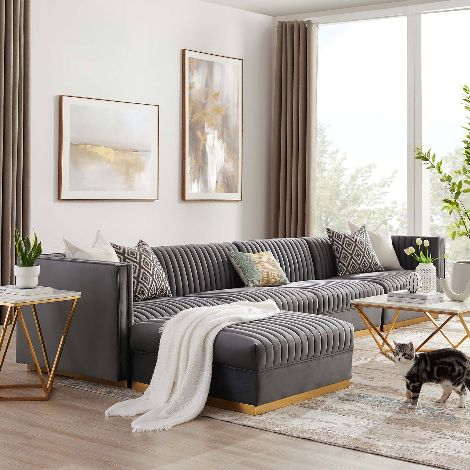 Gray velvet modular sectional with chaise in a modern living room layered with warm metallic accents. || EEI-5828-GRY || front_angle_room