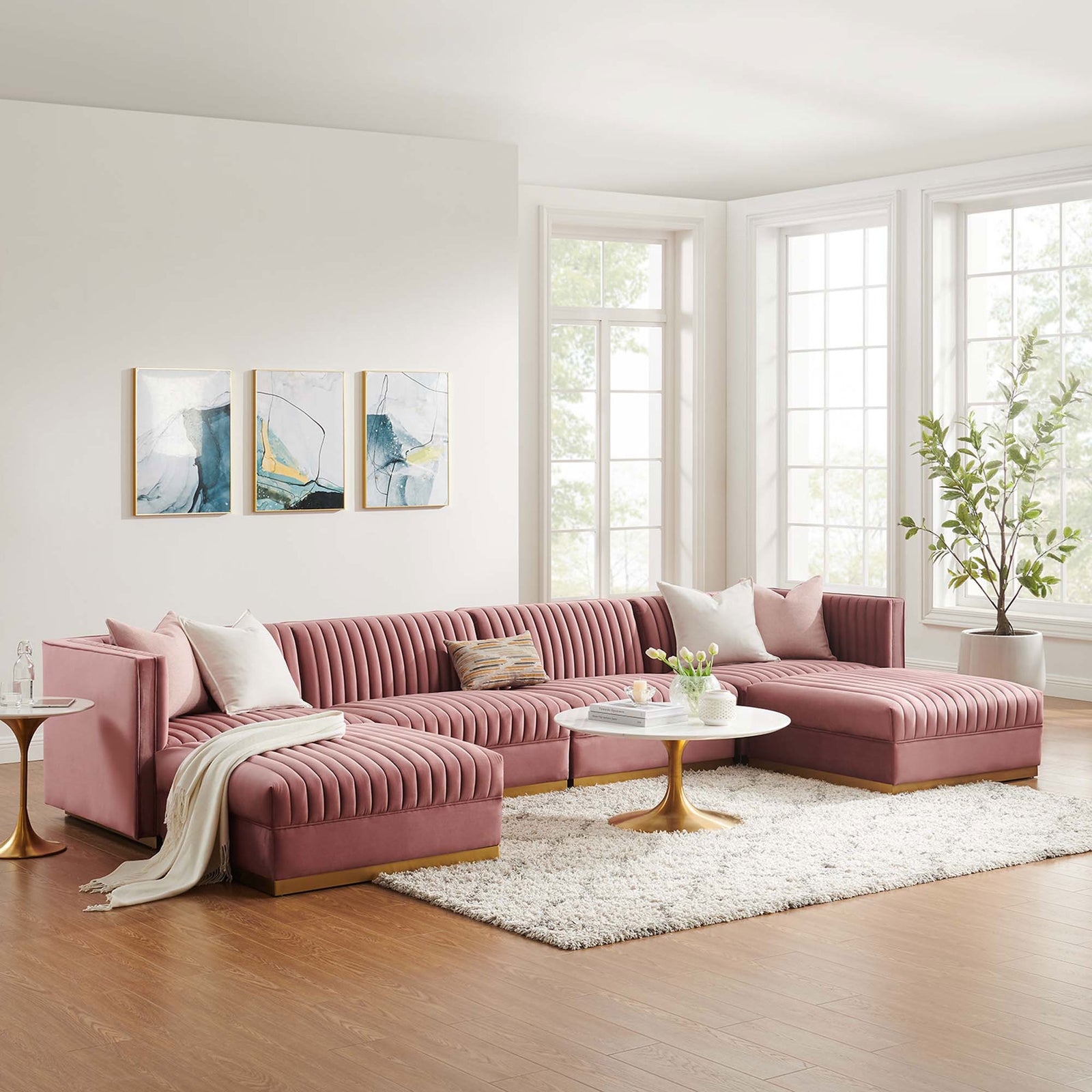 Dusty rose modular sectional anchors a bright modern living room with round gold coffee tables || EEI-5841-DUS || front_room