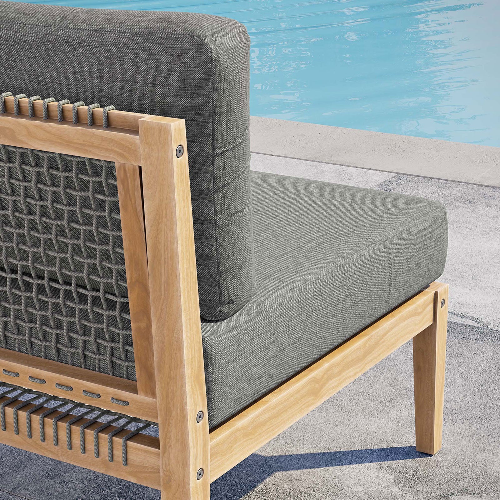 Gray graphite cushion and woven rope back detail on teak frame bringing texture beside the pool || EEI-5856-GRY-GPH || detail_room