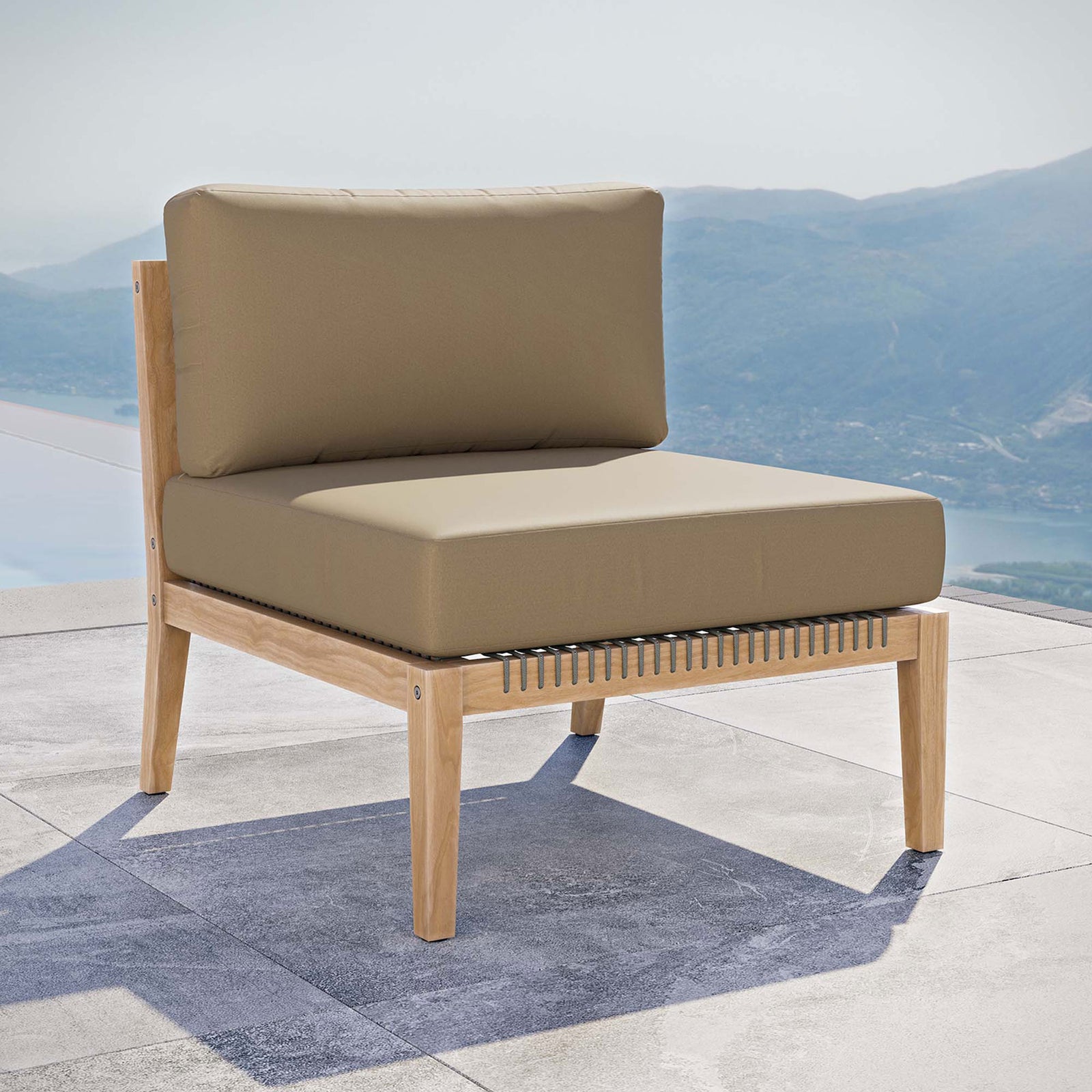 Light brown teak armless chair arranged by the pool to create a relaxed resort inspired setting || EEI-5856-GRY-LBR || front_angle_room