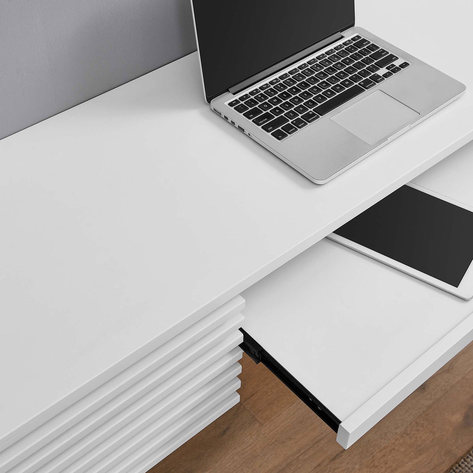 Work surface detail with laptop and slide-out keyboard tray for a clean, organized setup || EEI-5865-WHI || storage_open_room