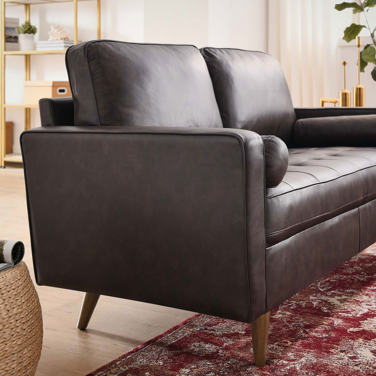 Brown leather loveseat styled in a modern living room with rug and brass accents || EEI-5870-BRN || front_angle_room