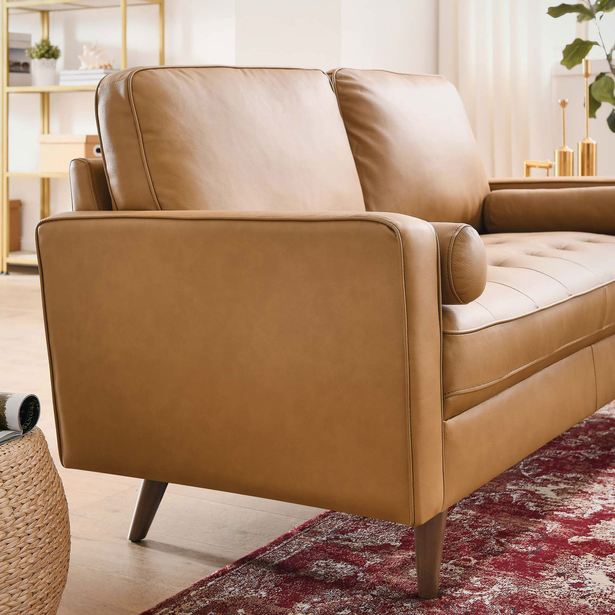 Tan leather loveseat styled in a modern living room with bolster pillows and tapered legs || EEI-5870-TAN || front_angle_room