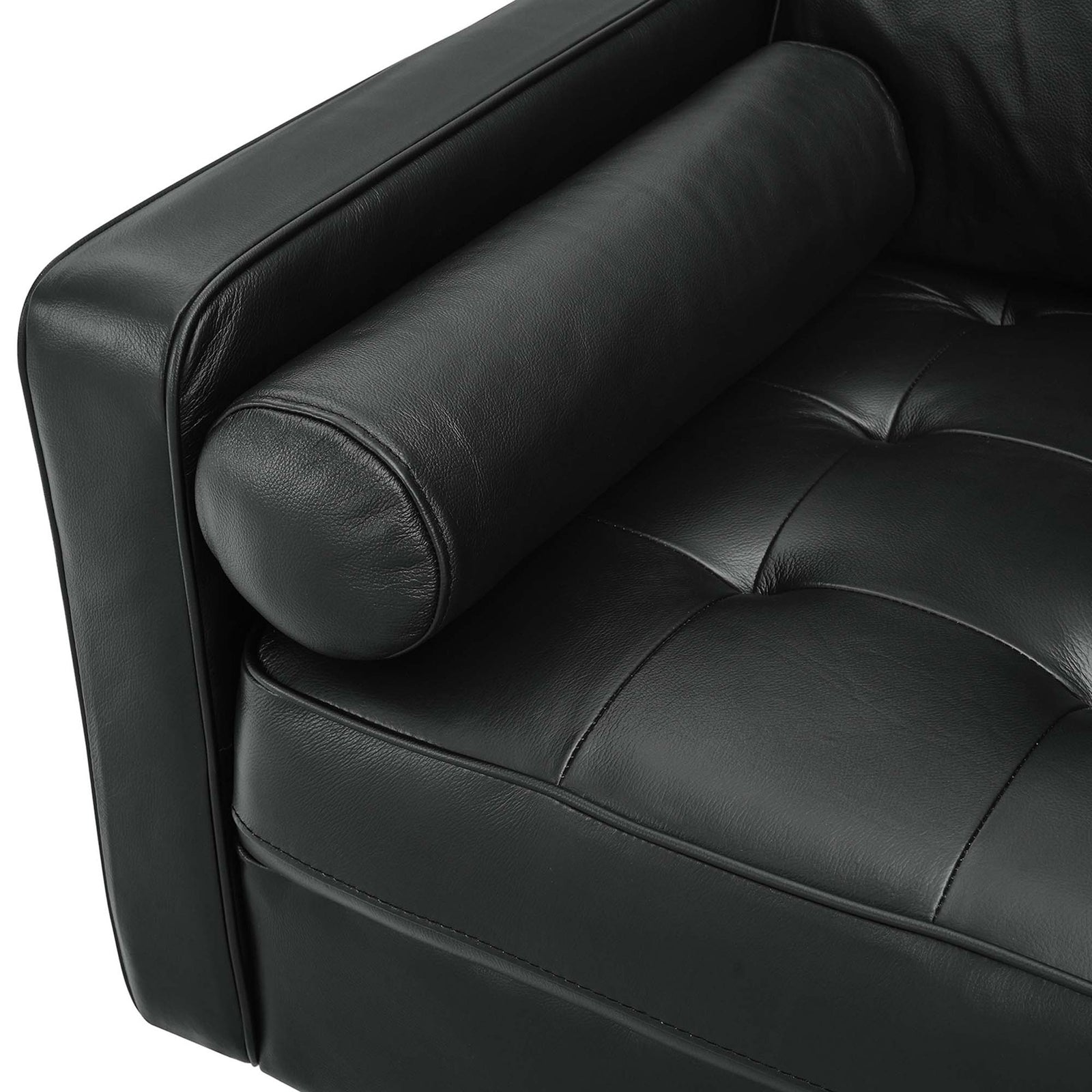 Soft tufted black leather seat and rounded bolster pillow show off the refined detailing of the Valour sofa. || EEI-5871-BLK || detail_studio