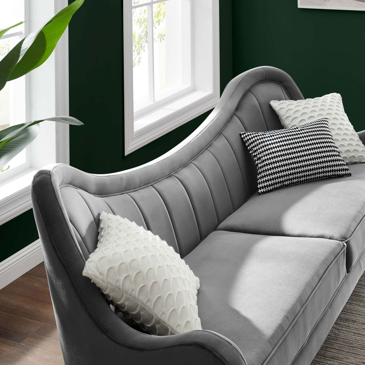 Gray velvet Cheshire sofa styled with accent pillows in a bright modern living room || EEI-5874-GRY || detail_room