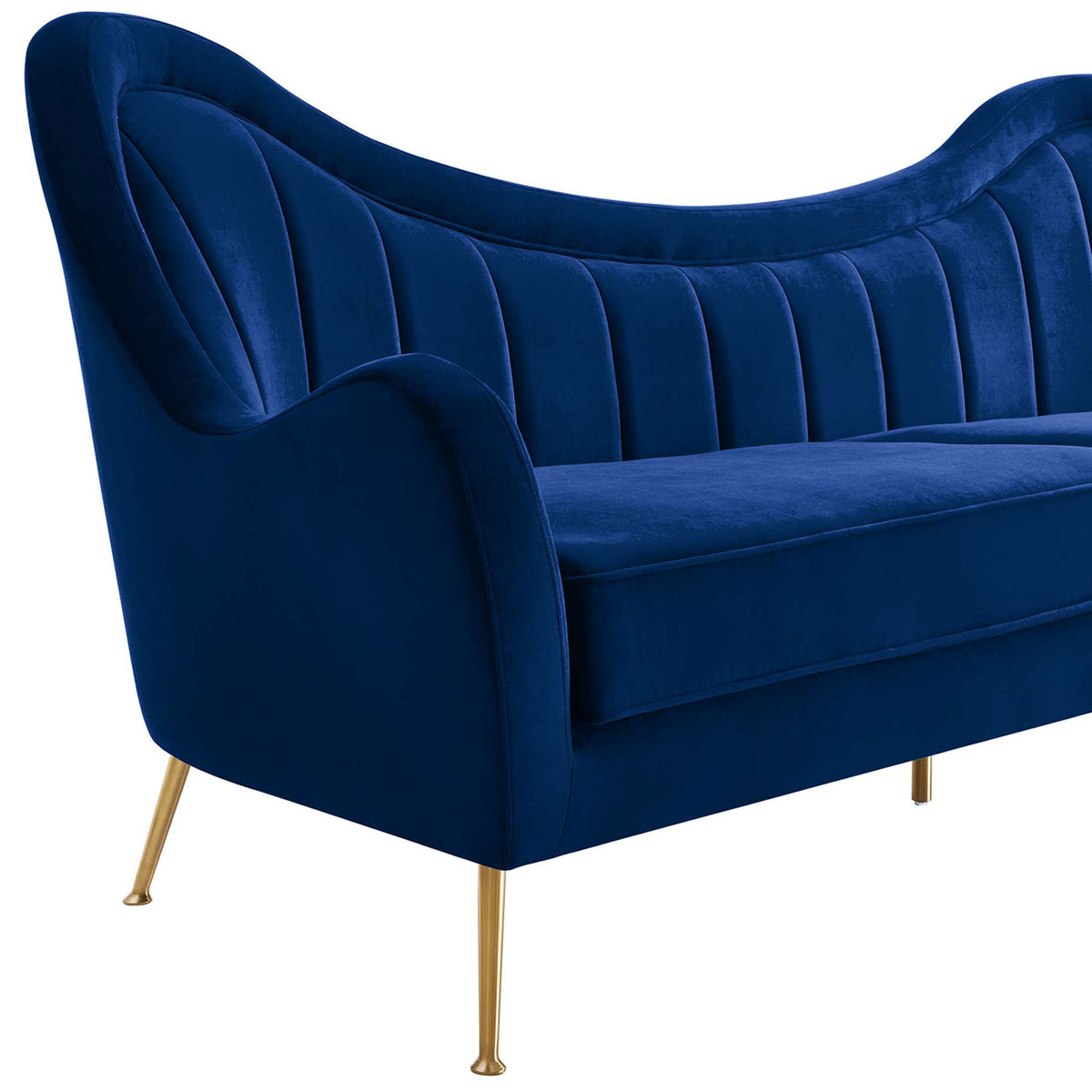 Detail of the sculpted arm and channel-tufted back of the navy velvet Cheshire sofa || EEI-5874-NAV || detail_studio