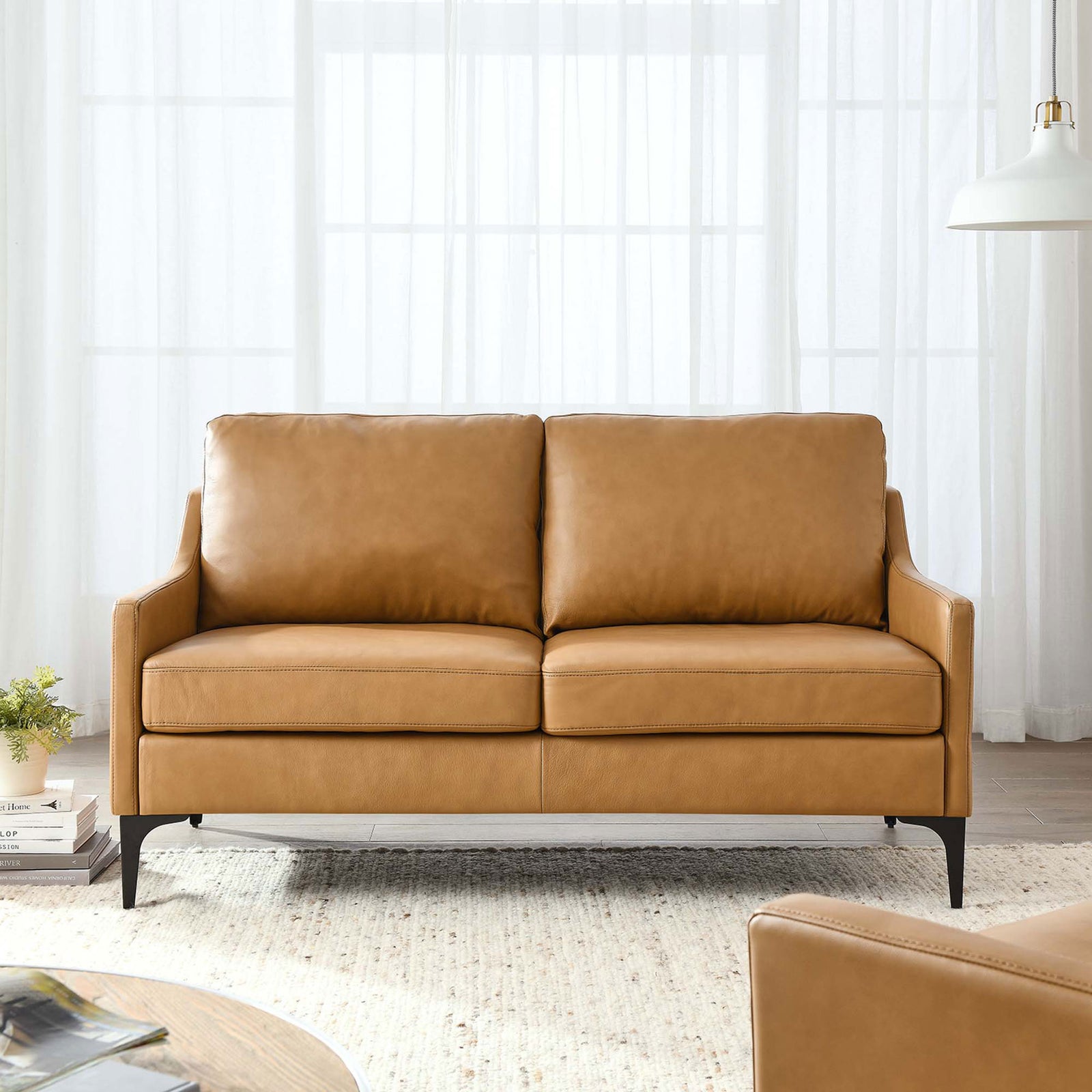 Tan leather loveseat styled in a bright living room with neutral rug and contemporary decor || EEI-6020-TAN || front_room
