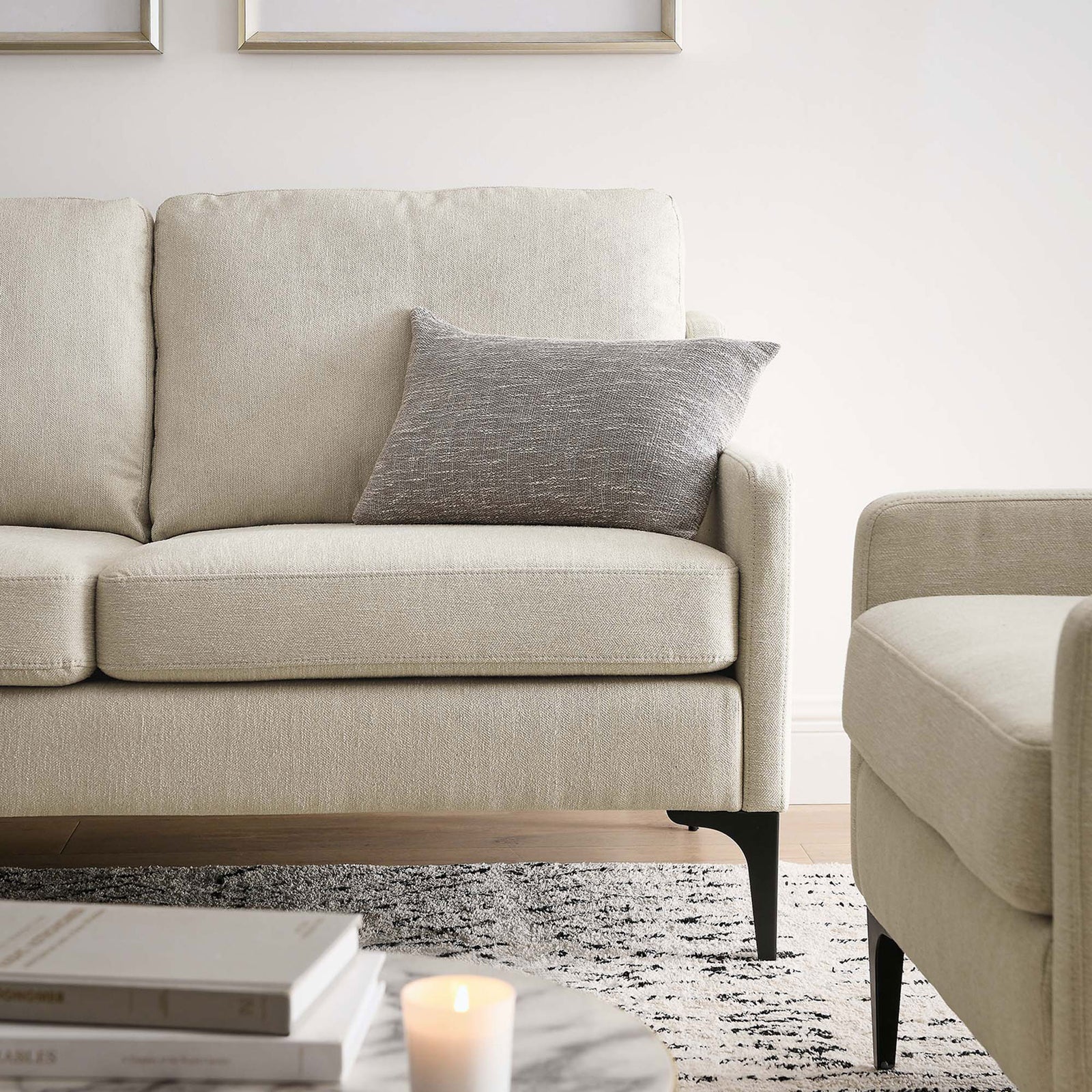 Lifestyle close-up of beige loveseat in a bright living room with accent pillow || EEI-6021-BEI || detail_room