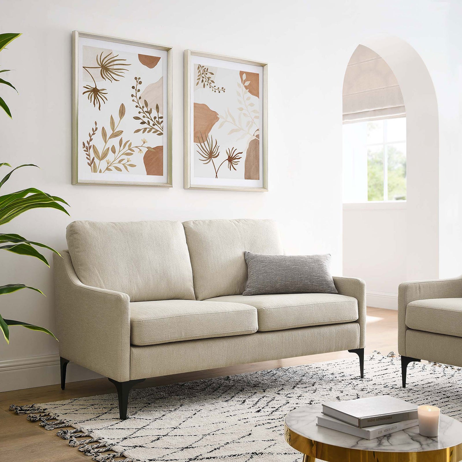 Beige loveseat styled in a modern living room with artwork and patterned rug || EEI-6021-BEI || front_room