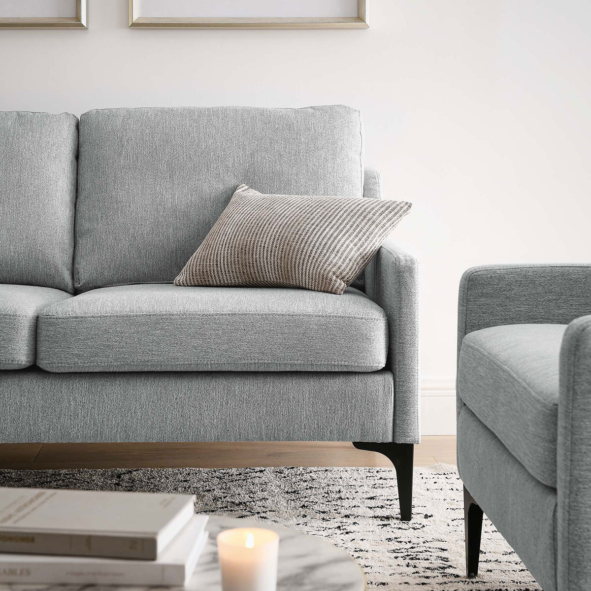 Corland light gray loveseat styled in a modern living room with accent pillow and black metal legs || EEI-6021-LGR || detail_room