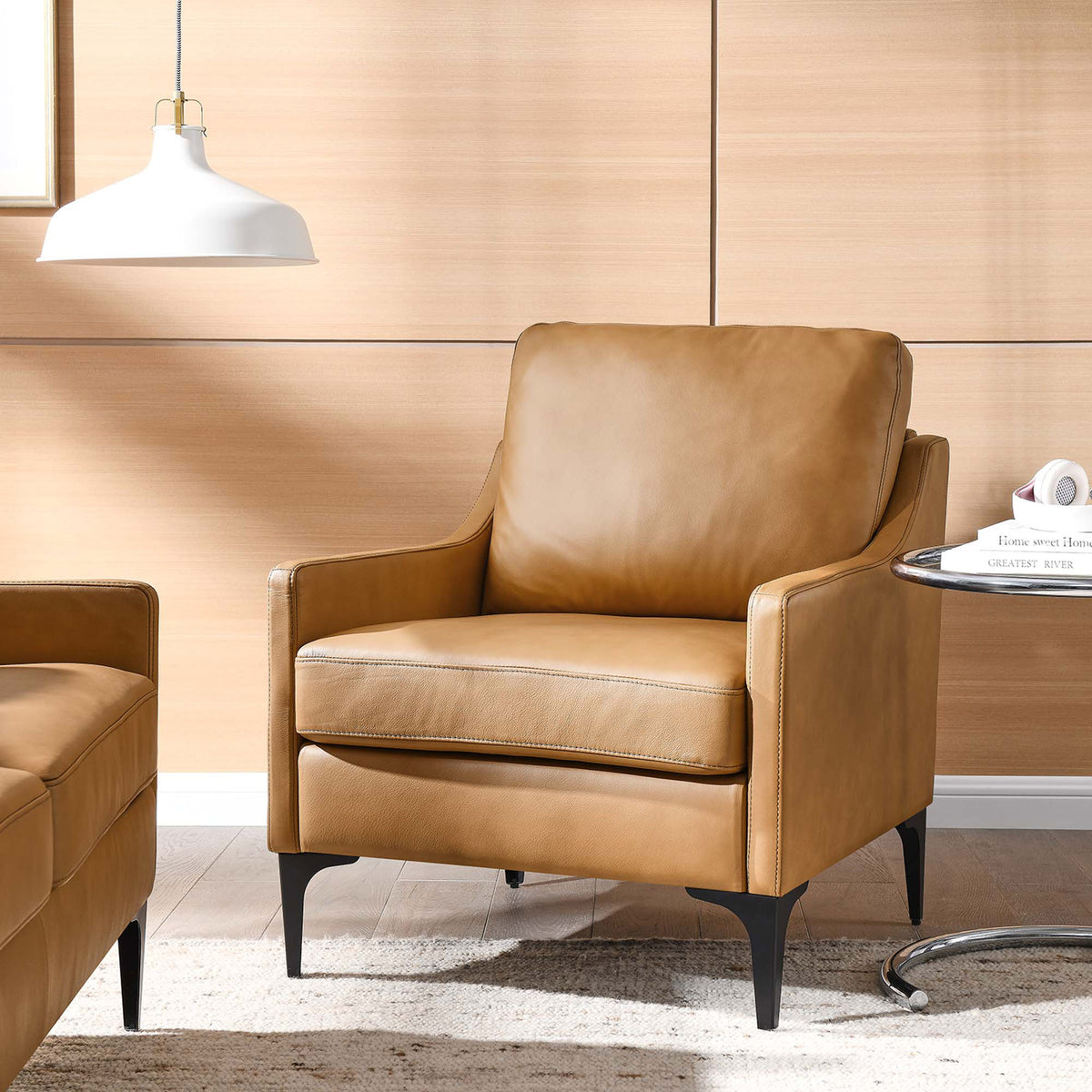 Cozy tan leather armchair elevates the living room with modern lines and slender black legs || EEI-6022-TAN || front_angle_room