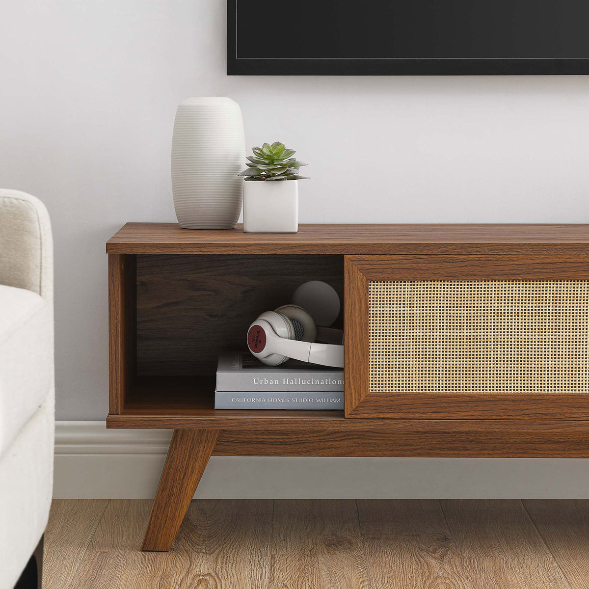 Walnut tv stand with open storage cubby styled with books and headphones || EEI-6039-WAL || storage_room