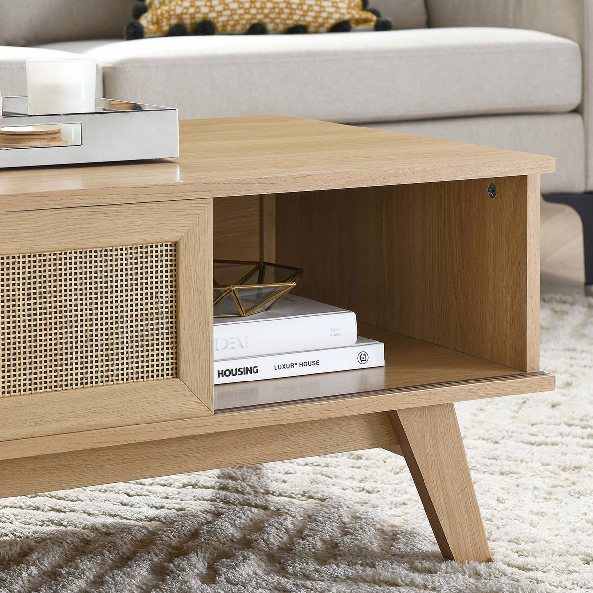 Open cubby offers easy storage for books and decor beside the woven rattan sliding door || EEI-6041-OAK || storage_room