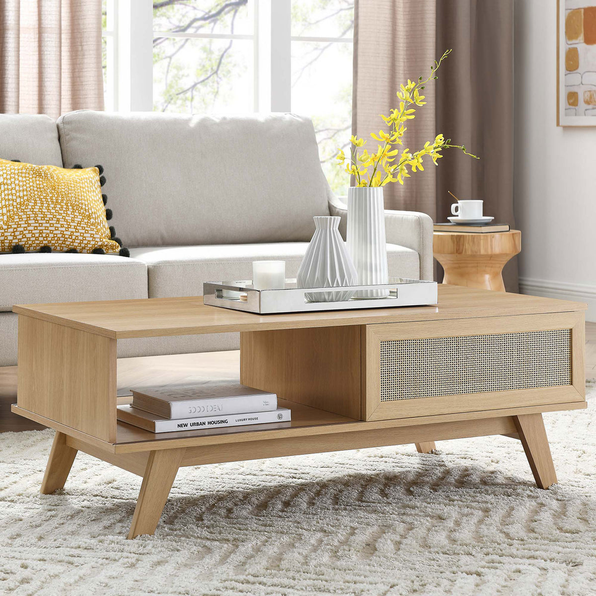 Oak coffee table with rattan door and open shelf anchors a modern living space || EEI-6041-OAK || front_angle_room