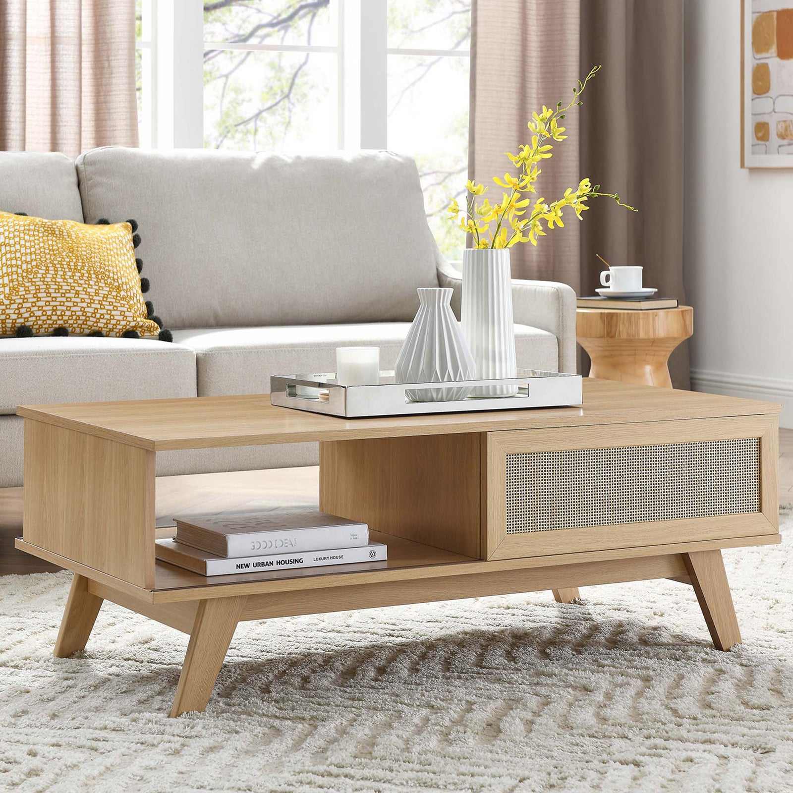 Oak coffee table with rattan door and open shelf anchors a modern living space || EEI-6041-OAK || front_angle_room