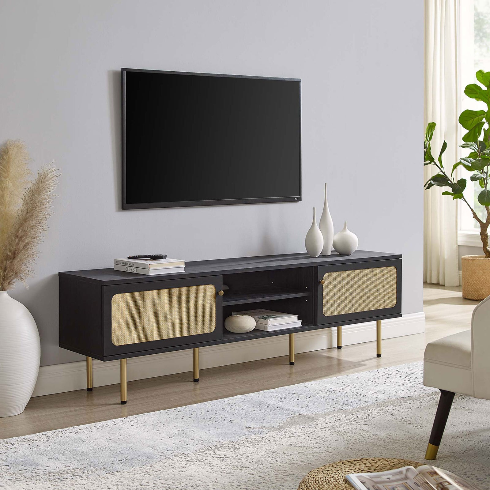 Extra-long black TV console with dual rattan doors and gold legs completing a spacious living room setup. || EEI-6046-BLK || front_angle_room