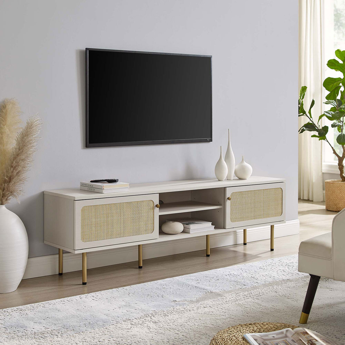 Extra-long white TV console with dual rattan doors and gold legs completing a spacious living area. || EEI-6046-WHI || front_angle_room