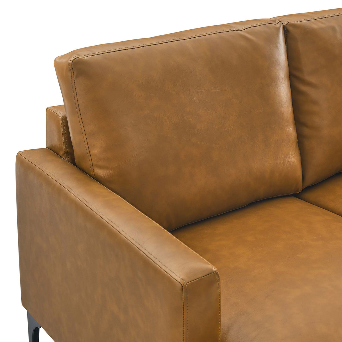 Tan vegan leather upholstery and plush cushioning highlight the arm and back of the Evermore sectional sofa || EEI-6050-TAN || detail_studio