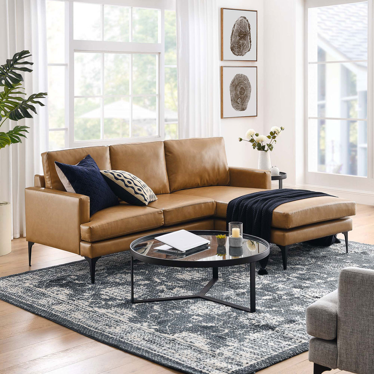 Tan Evermore right-facing vegan leather sectional sofa styled in a bright living room with modern decor || EEI-6050-TAN || front_angle_room