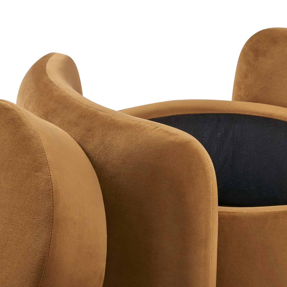 Cognac velvet upholstery and sculpted side panels shown in detail around the ottoman storage opening || EEI-6055-COG || detail_studio