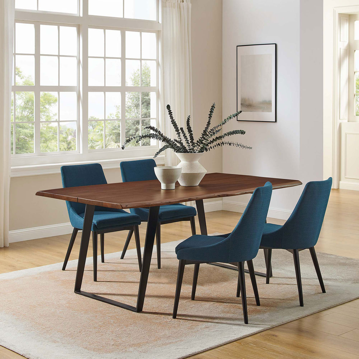 Bright dining room showcases the 74 in Viggo table with teal upholstered chairs and neutral rug || EEI-6069-BLK-WAL || front_angle_room