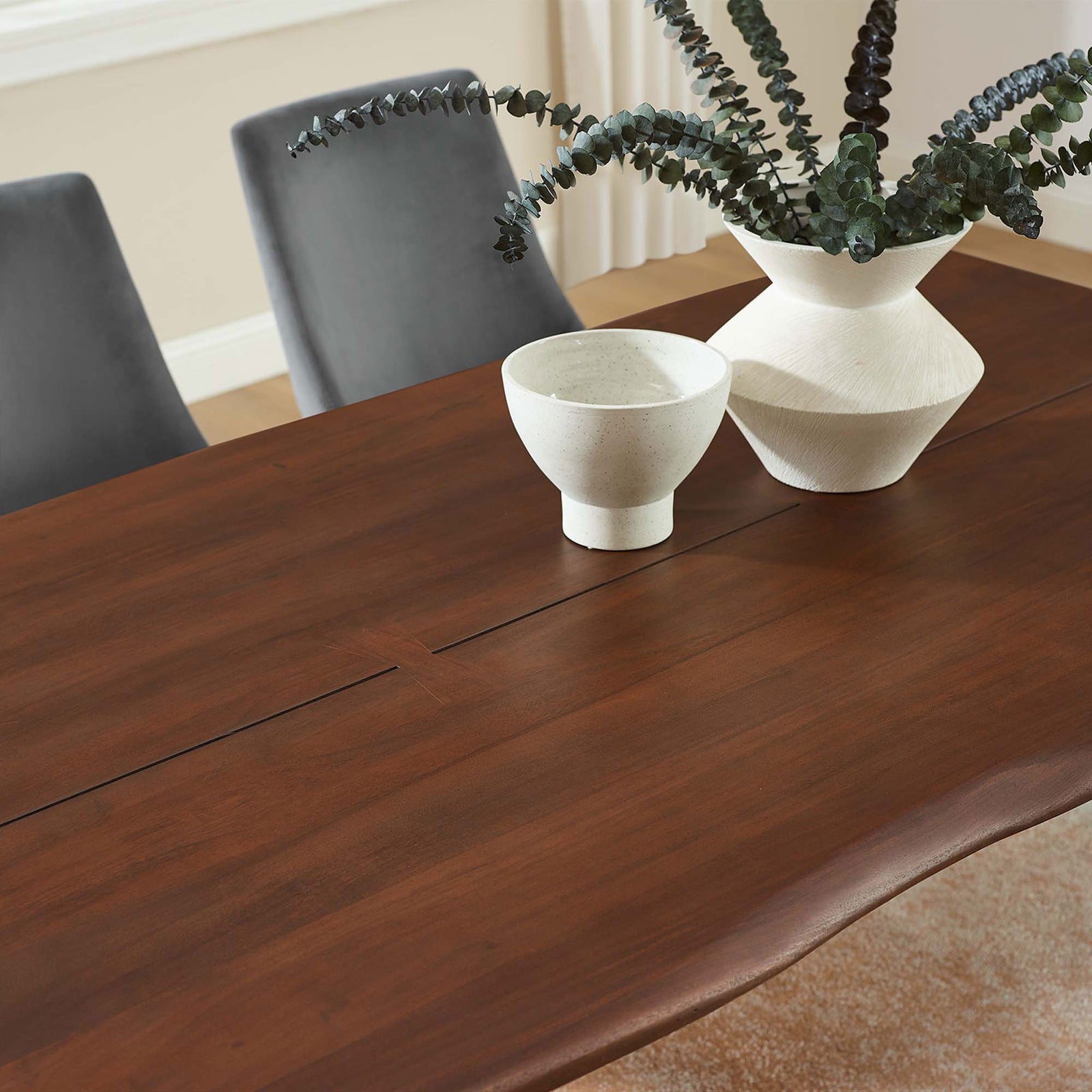 Walnut acacia tabletop styled with sculptural vases and greenery, emphasizing the table's rich tone and smooth finish || EEI-6070-GLD-WAL || detail_room