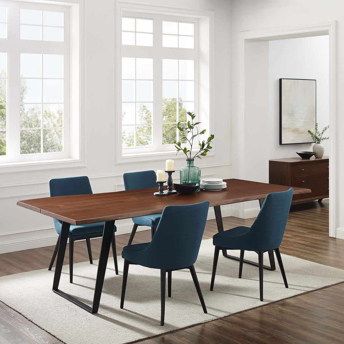 Spacious dining room showcases the 96 in Viggo live edge table paired with modern blue chairs || EEI-6071-BLK-WAL || front_angle_room