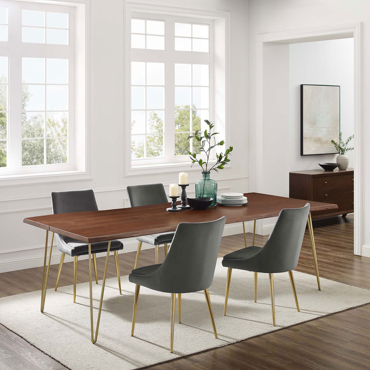 Ardor 96 inch live edge dining table anchoring a spacious dining room with gray chairs, rug, and sideboard || EEI-6072-GLD-WAL || front_angle_room