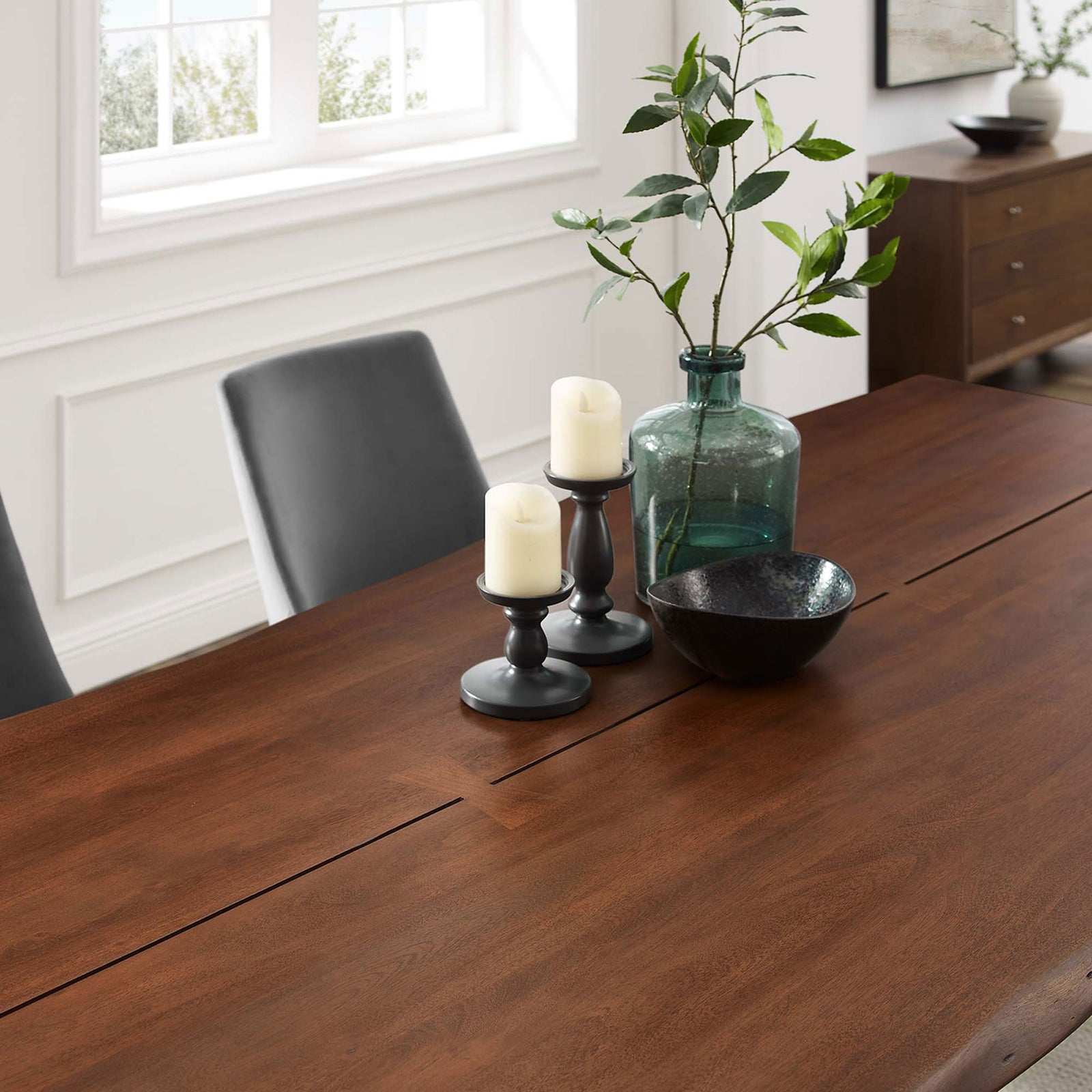 Walnut acacia tabletop arranged with candles and decor, emphasizing the table's generous scale and smooth surface || EEI-6072-GLD-WAL || detail_room