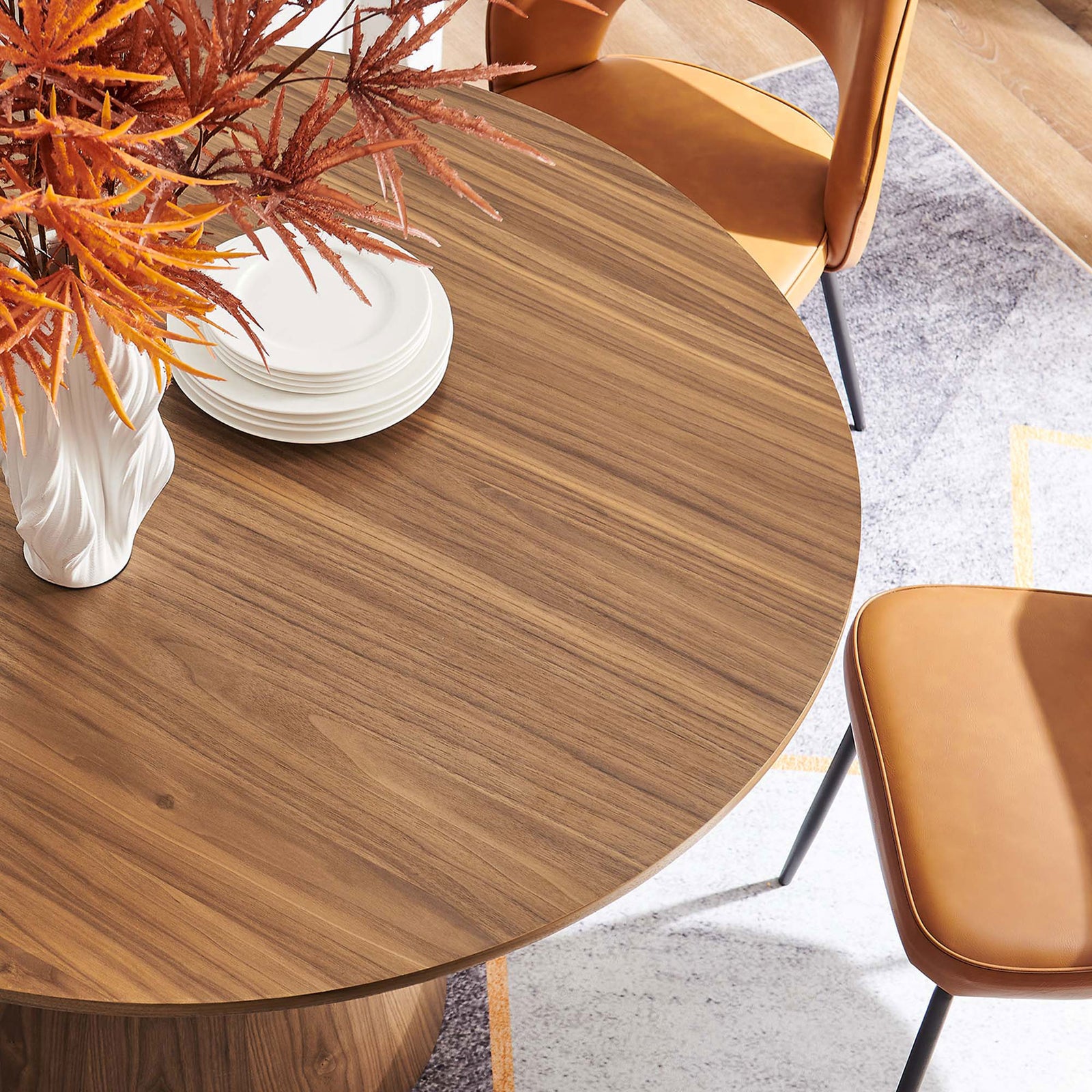 Walnut dining tabletop styled with modern chairs and decor to showcase its warm, inviting finish || EEI-6102-WAL || detail_room