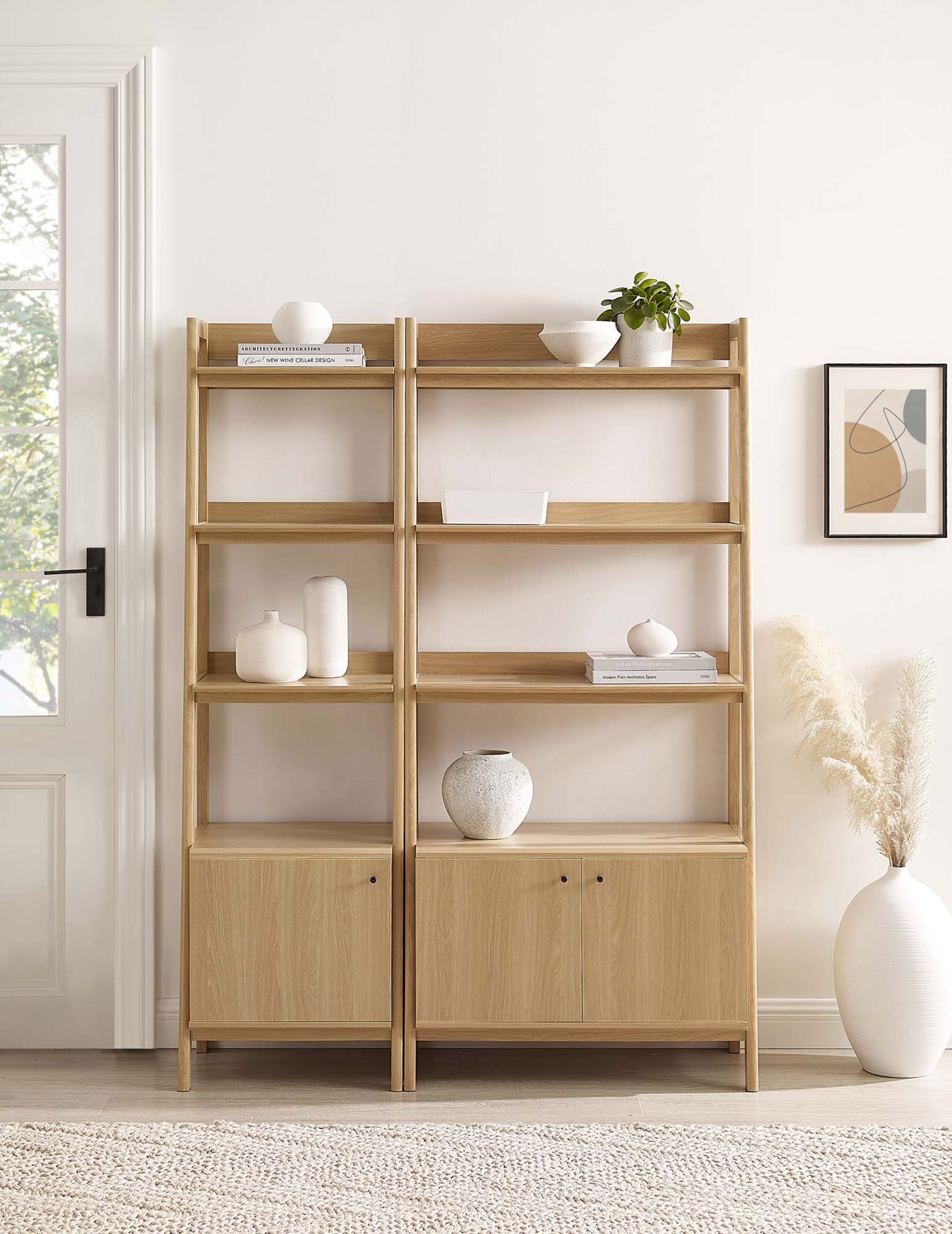 Two-piece bookshelf set styled with ceramics, offering ample display space and closed storage below || EEI-6113-OAK || front_room