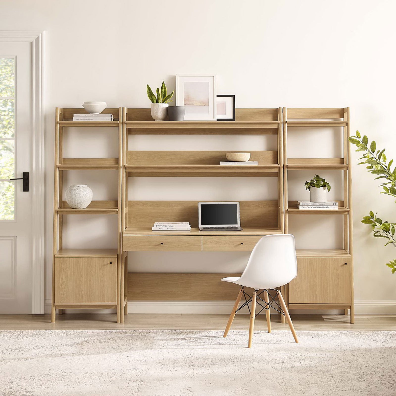 Modern oak wall unit with ladder-style shelves, center desk, and hidden storage below || EEI-6114-OAK || front_room