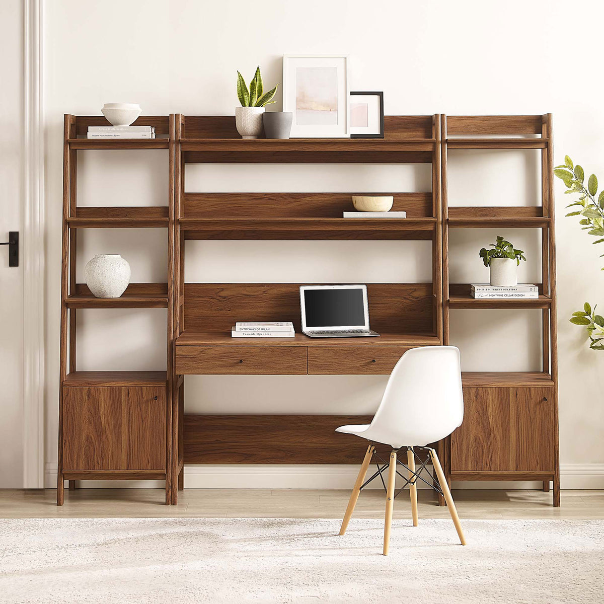 Warm walnut finish and ladder-style shelving create a modern home office hub with drawers and hidden base cabinets || EEI-6114-WAL || front_room