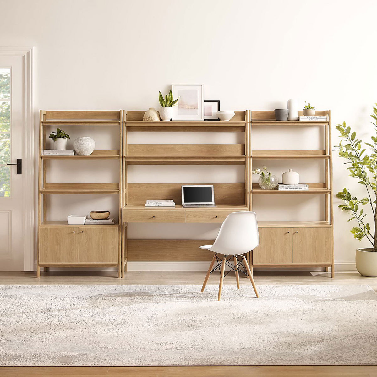 Three-piece office hub pairs a wide desk with two ladder bookcases for display and hidden storage in oak || EEI-6115-OAK || front_room