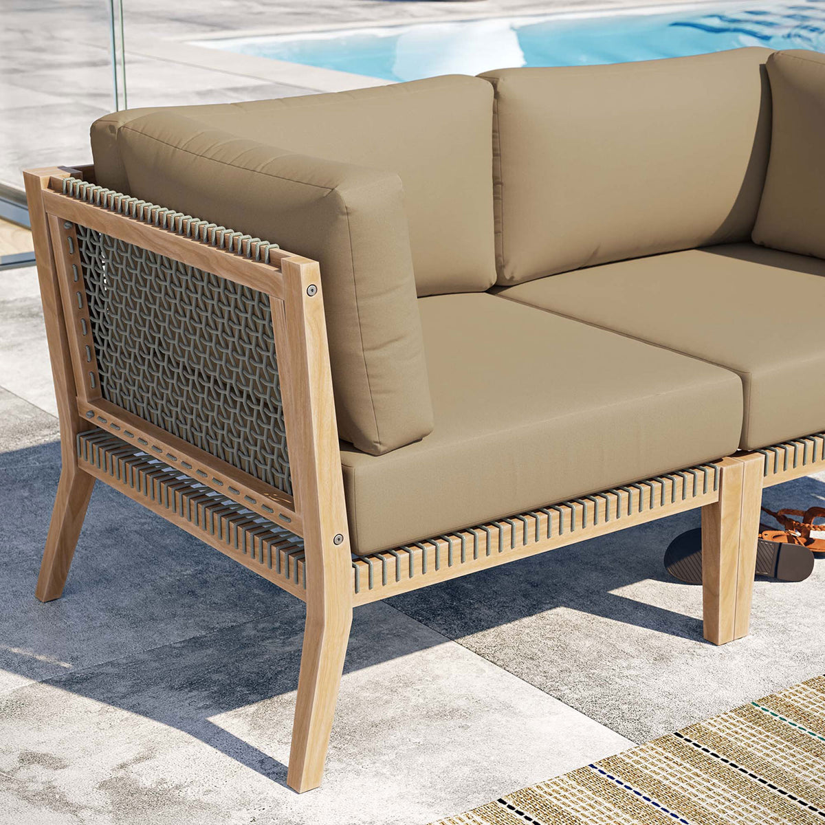 Poolside detail of teak frame, woven rope, and light brown cushions on the Clearwater loveseat || EEI-6119-GRY-LBR || detail_room