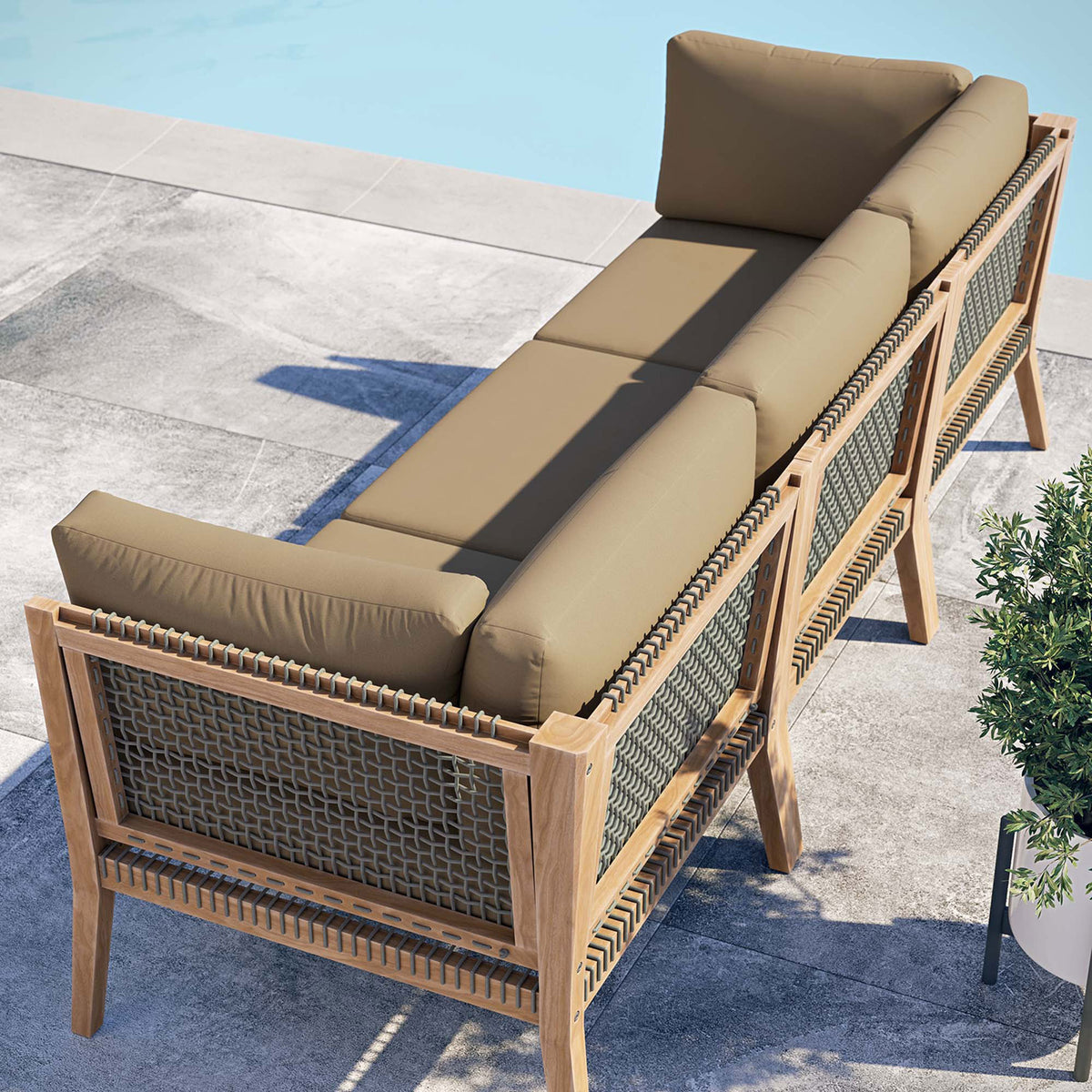 Light brown outdoor sofa poolside showing rope back panels and teak frame || EEI-6120-GRY-LBR || back_angle_room