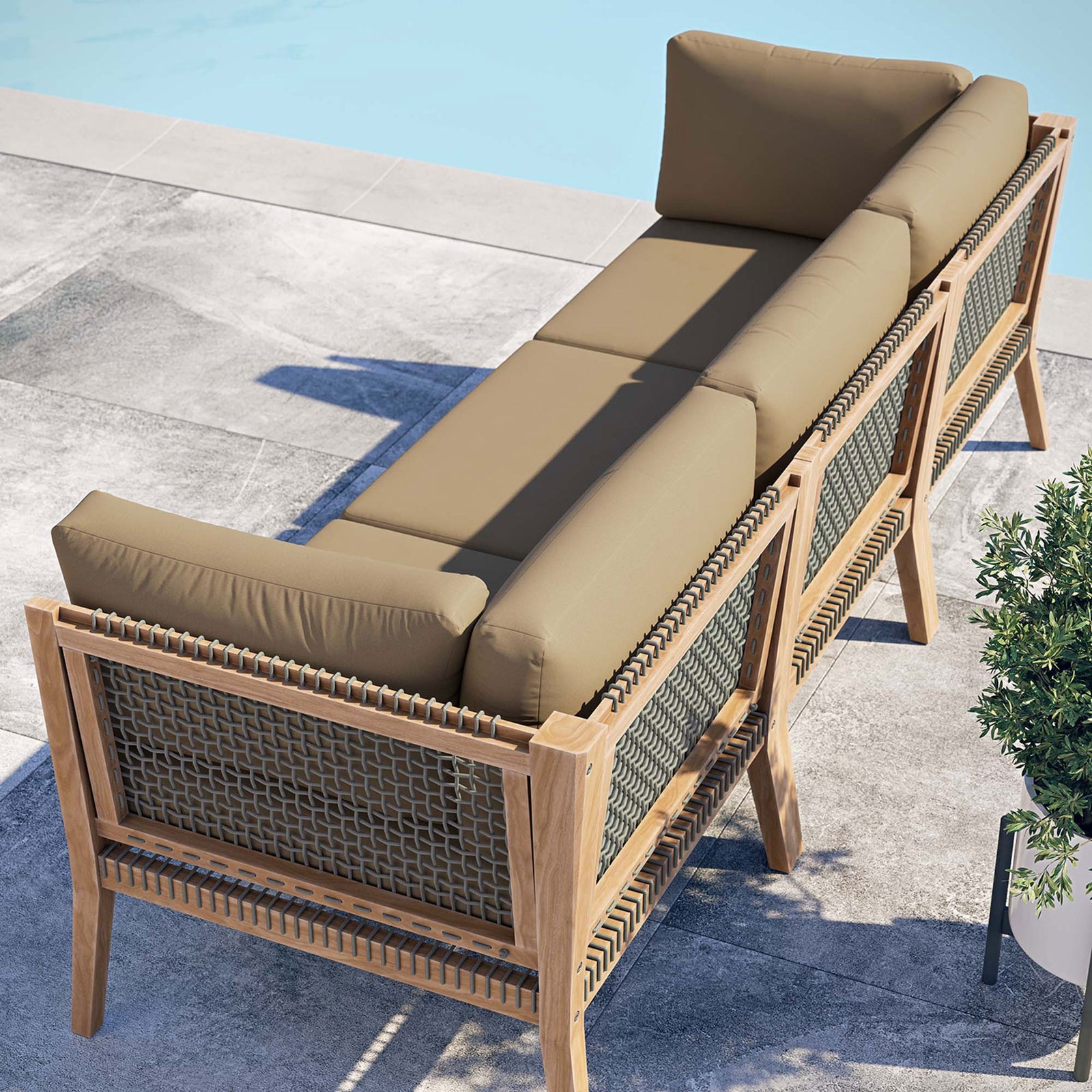 Light brown outdoor sofa poolside showing rope back panels and teak frame || EEI-6120-GRY-LBR || back_angle_room