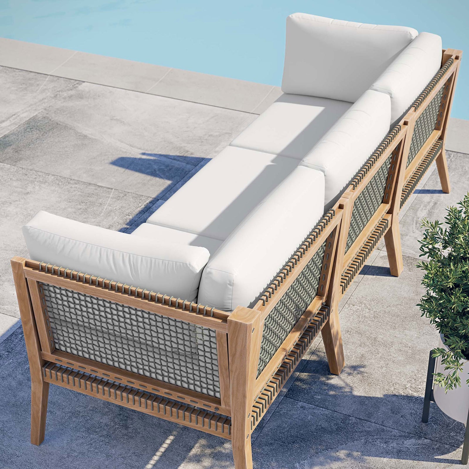 White outdoor sofa poolside showing rope back panels and teak frame || EEI-6120-GRY-WHI || back_angle_room