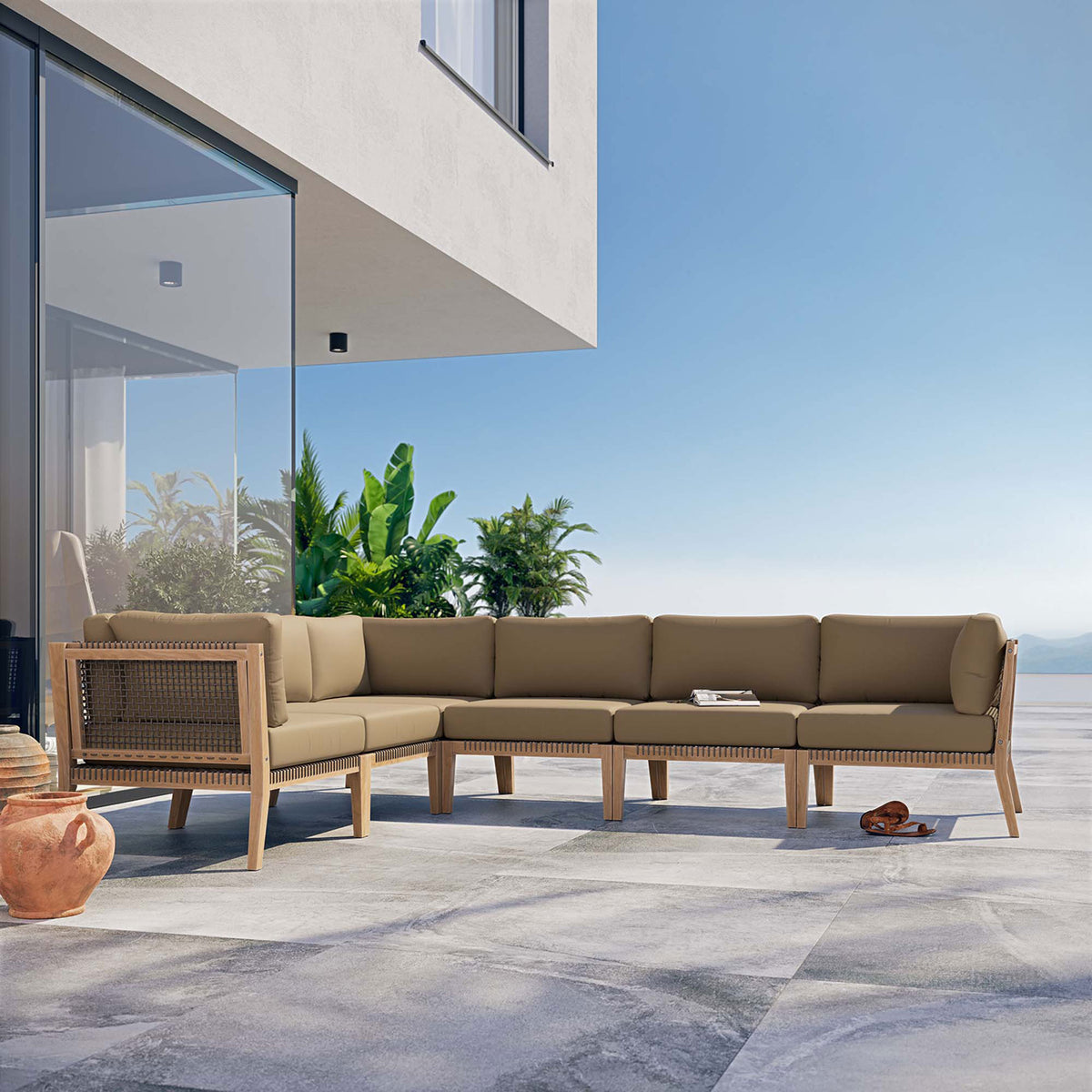Light brown sectional styled on a sunny terrace with ocean and greenery backdrop || EEI-6125-GRY-LBR || front_angle_room